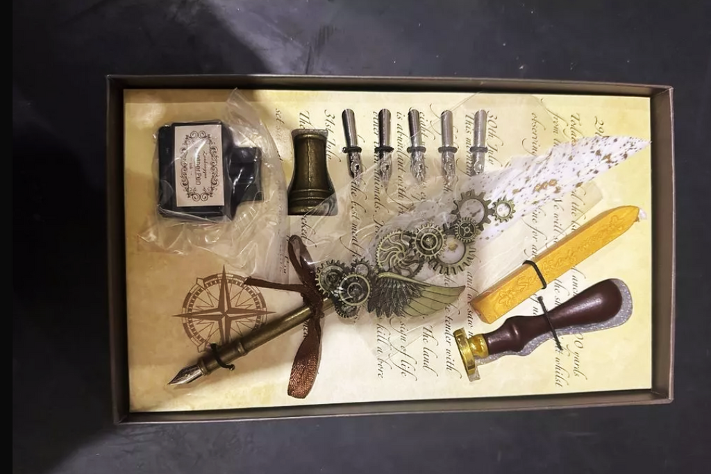 Fountain pen with interchangeable nibs, stand, and wax candle with sealing stamp/mold