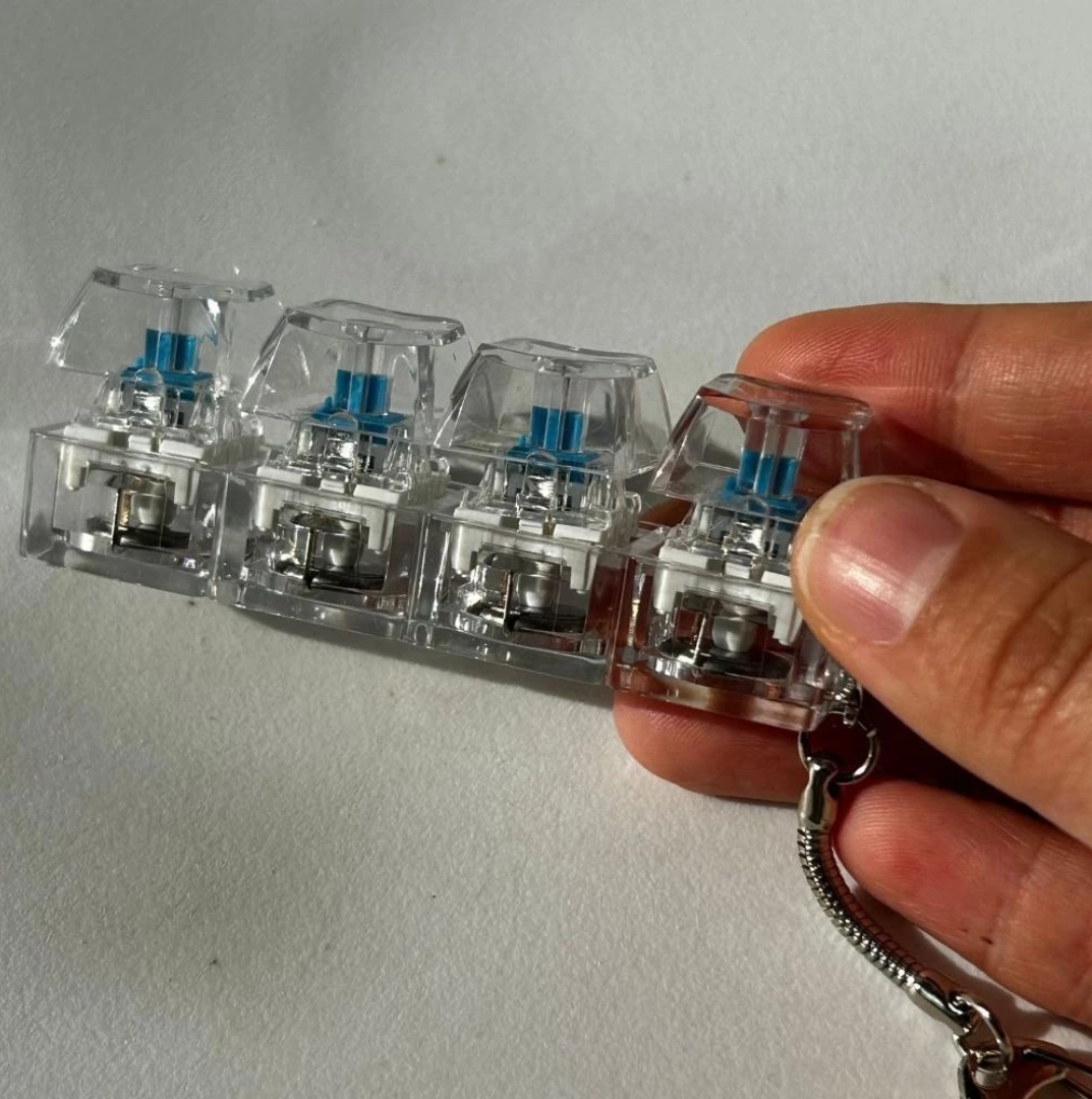 Keychain, 4 Key Finger Keyboard for Stress Relief.